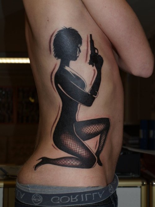 Black Ink Girl With Gun Tattoo On Side