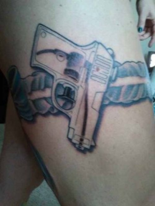 Gun Tattoo On Right Thigh
