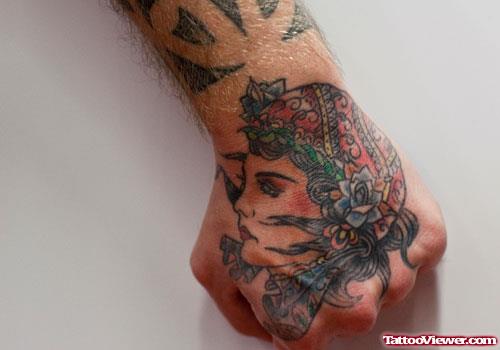 Colored Gypsy Head Tattoo On Left Hand