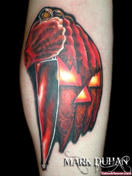 Red Ink Halloween Tattoo On Leg