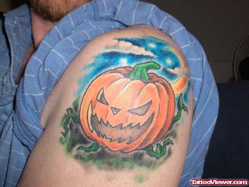 Halloween Pumpkin Color Tattoo On Left Shoulder