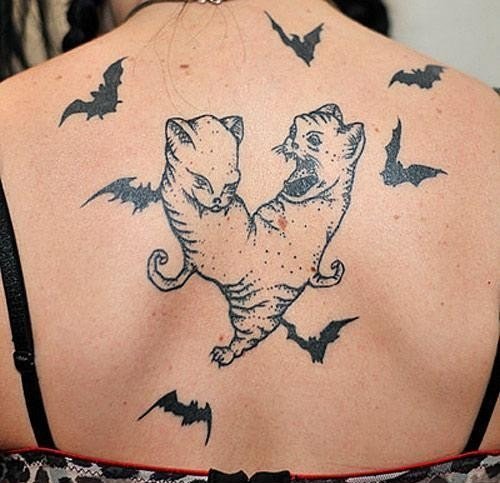 Flying Bats And Fighting Cats Halloween Tattoo On Back