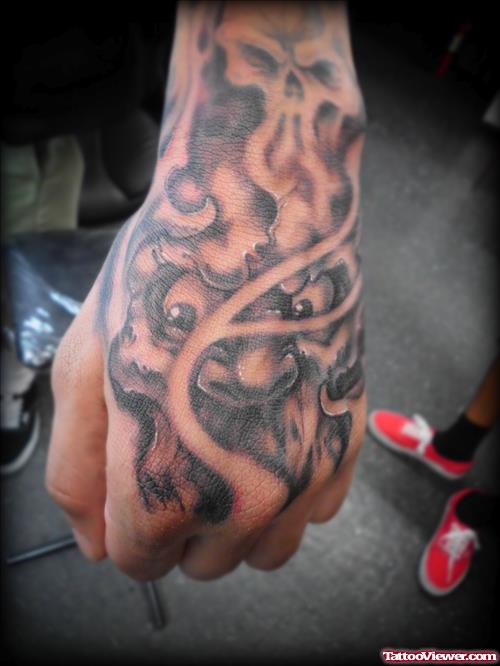 Best Grey Ink Skull Hand Tattoo
