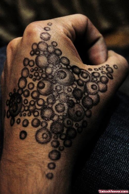 Grey Ink Bubbles Hand Tattoo