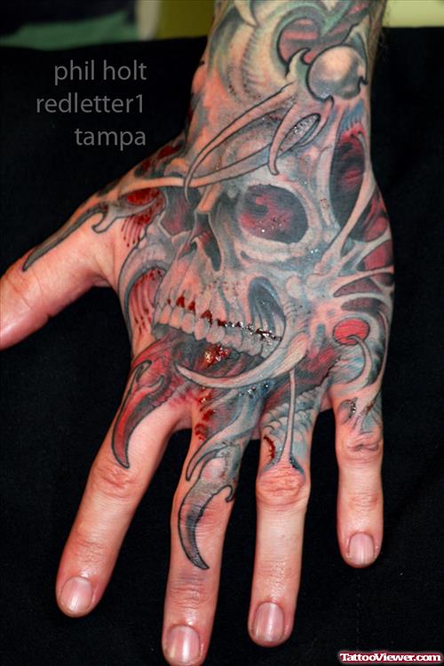 Biomechanical Skull Hand Tattoo