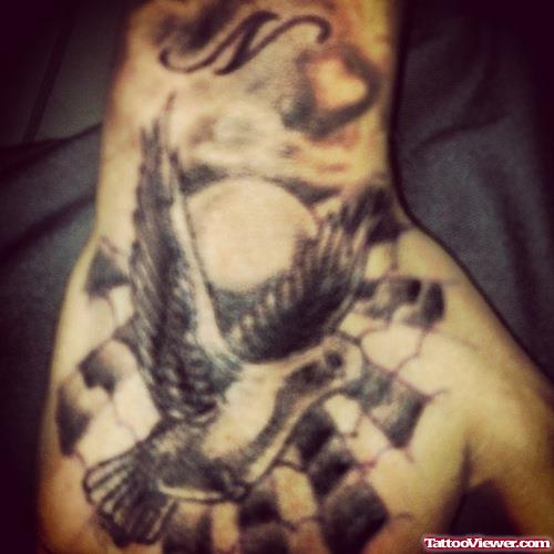 Grey Ink Us Flag And Flying Dove Hand Tattoo