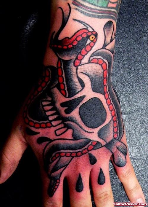 Skull And Snake Hand Tattoo