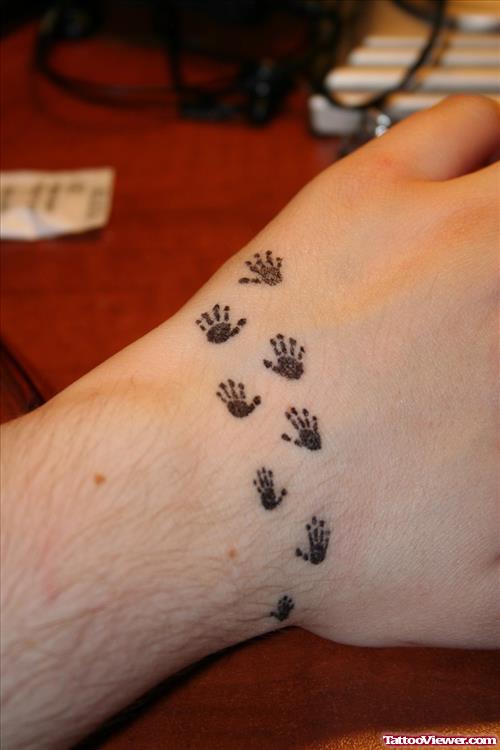 Small Hand Prints Hand Tattoo