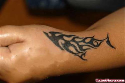 Awesome Black Ink Tribal Tattoo On Left Hand