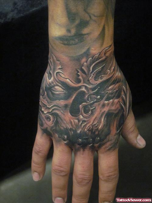 Grey Ink Scary Demon Skull Hand Tattoo