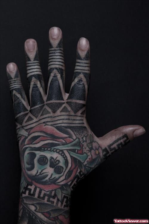 Black Ink Tribal And Apple Skull Hand Tattoo