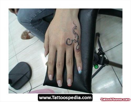 Grey Ink Tribal Tattoo On Left Hand