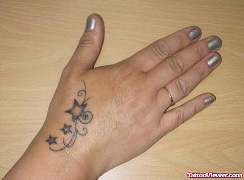 Grey Ink Stars Hand Tattoo For Girls