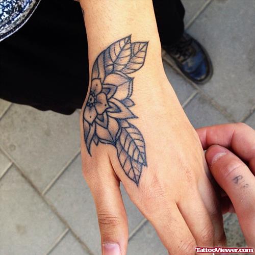 Amazing Grey Ink Flower Hand Tattoo