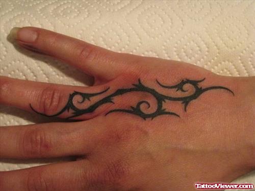 Amazing Black Tribal Tattoo On Right Hand