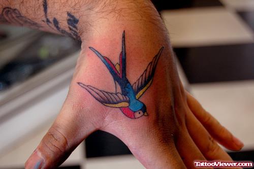 Colored Flying Swallow Hand Tattoo