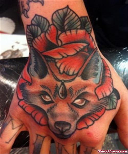 Cool Flower And Fox Head Hand Tattoo