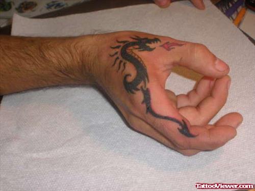 Black Ink Dragon Tattoo On Right Hand