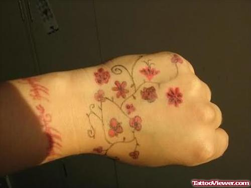 Red Flowers Tattoos On Hand