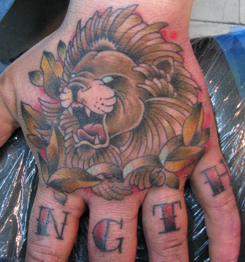 Awesome Lion Head Hand Tattoo