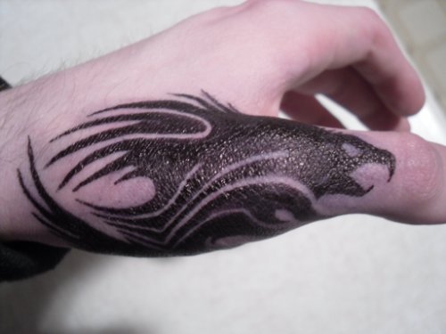 Black Ink Tribal Eagle Tattoo On Left Hand