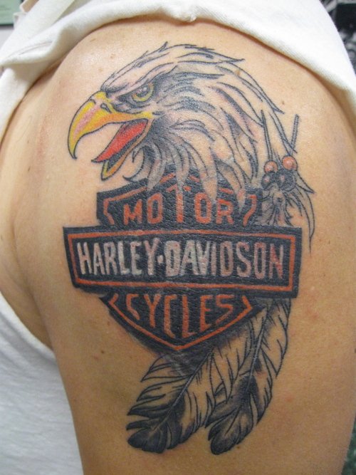 Grey Ink Eagle Head And Harley Tattoo On Left Shoulder