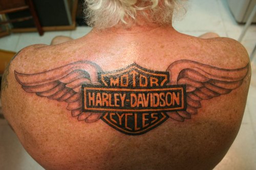Amazing Winged Harley Tattoo On Upperback
