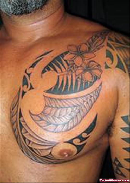 Amazing Hawaiian Tattoo On Man Chest And Half Sleeve
