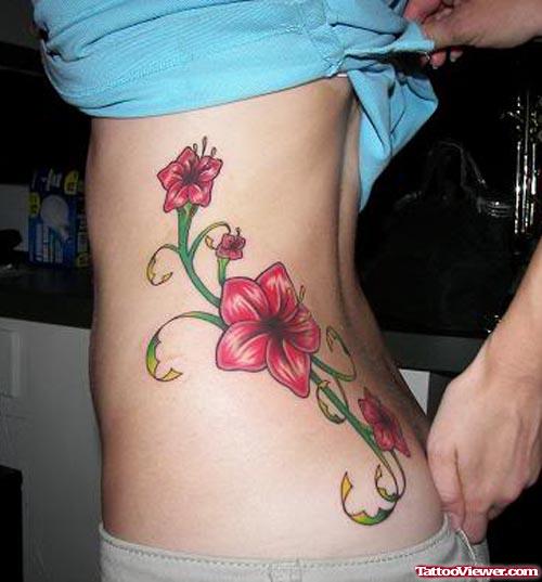 Awesome Color Hibiscus Hawaiian Flower Tattoo On Side Rib