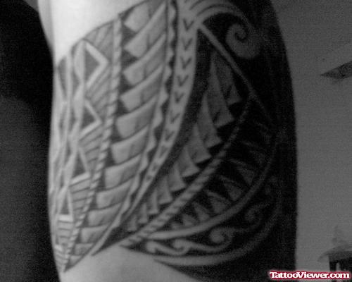 Grey Ink Hawaiian Tattoo On Muscles