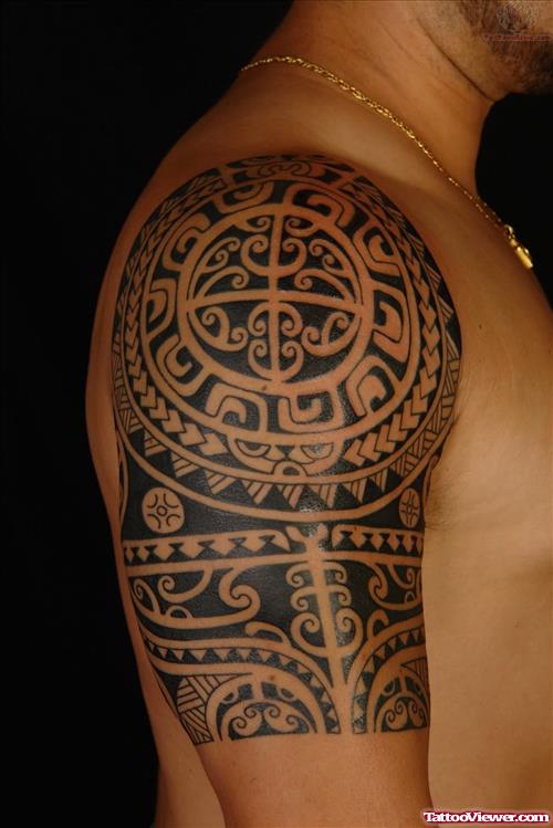 Black Ink Tribal Hawaiian Tattoo On Man Right Half Sleeve