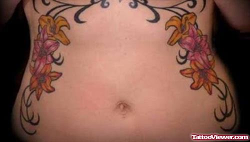 Girl With Hawaiian Tattoos On Side Ribs