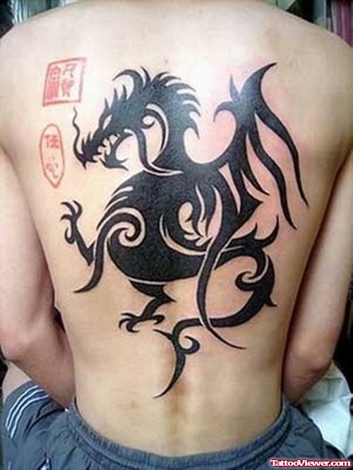 Black Ink Dragon Hawaiian Tattoo On Back