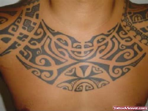 Black Ink Tribal Hawaiian Tattoo On Man Chest