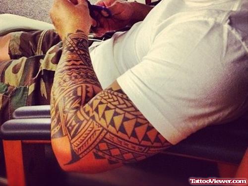 Amazing Hawaiian Tattoo On Man Left Sleeve