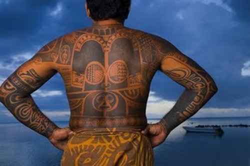 Black Ink Hawaiian Tattoo On Back And Both Sleeves