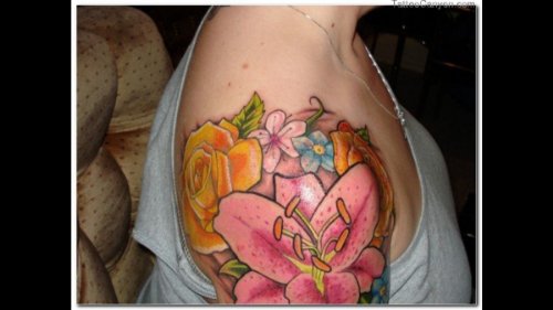 Colored Hawaiian Flowers Tattoos On Right Shoulder