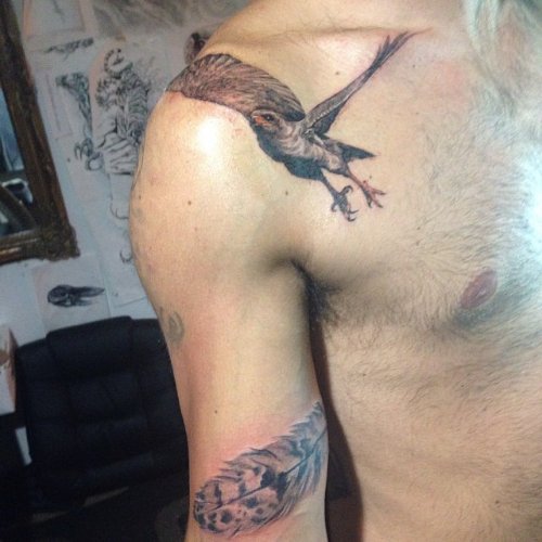 Grey Ink Feather And Flying Hawk Tattoo On Shoulder