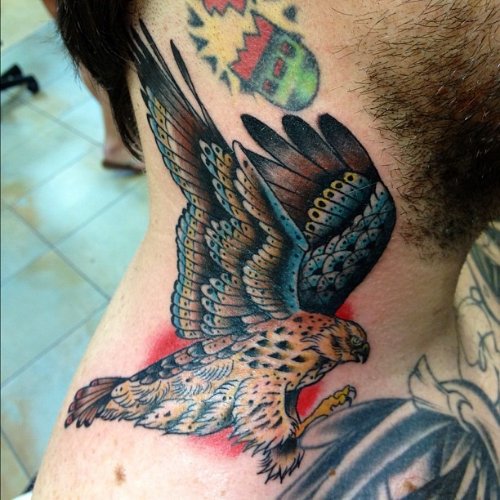 Colored Hawk Tattoo On Man Neck