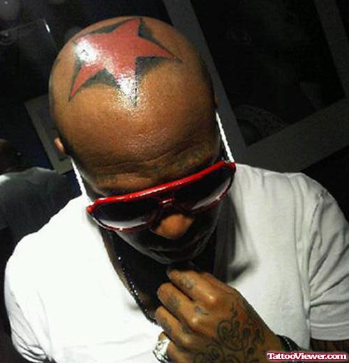 Attractive Red Ink Star Head Tattoo