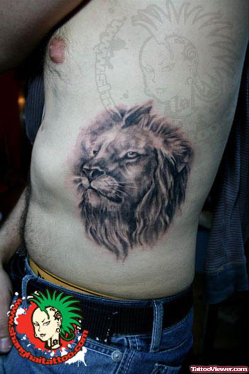 Grey Ink Lion Head Tattoo On Man Side Rib