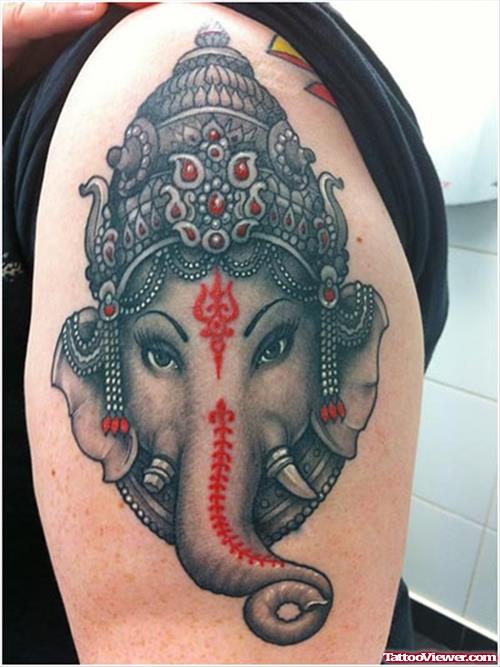 Grey Ink Ganesha Head Tattoo On Shoulder