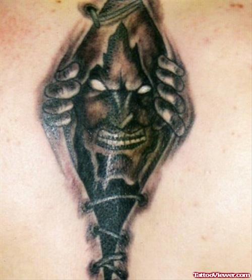 Ripped Skin Demon Head Tattoo