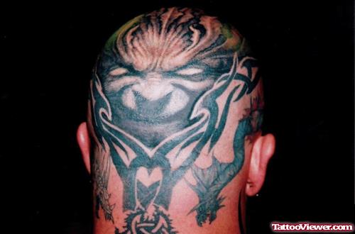 Grey Ink Tribal And Scary Back Head Tattoo