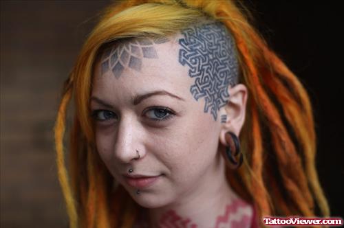 Attractive Black Ink Tribal Head Tattoo For Girls