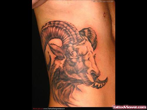 Grey Ink Goat Head Tattoo On Side Rib