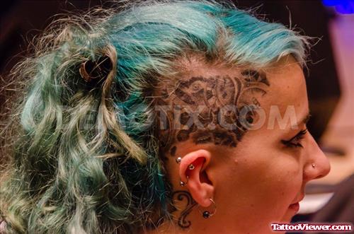 Grey Ink Polynesian Head Tattoo