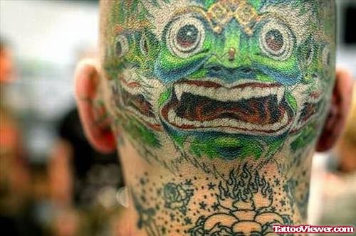 Green Face Tattoo On Head