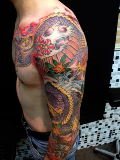 Awesome Colored Dragon Head Tattoo On Sleeve