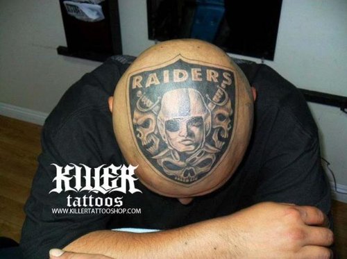 Black Ink Raiders Head Tattoo For Men